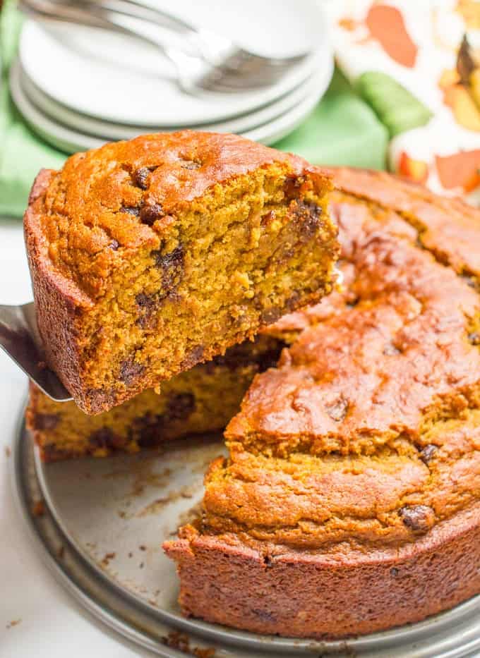 A slightly healthier banana pumpkin chocolate chip cake recipe with rich chocolate flavor and tall thick slices - a delicious fall dessert!