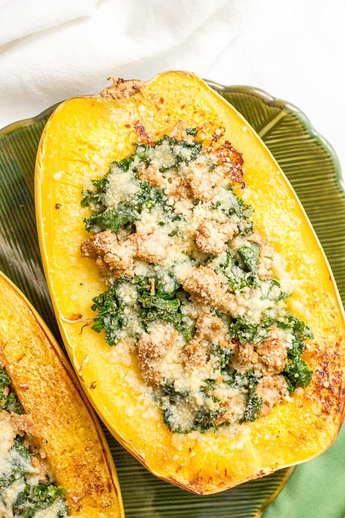 Stuffed spaghetti squash with sausage and kale is an easy 6-ingredient recipe for a delicious, hearty dinner!