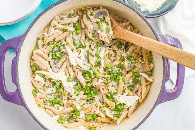 One-pot creamy chicken and mushroom pasta with peas is an easy, complete dinner that’s ready in about 30 minutes!