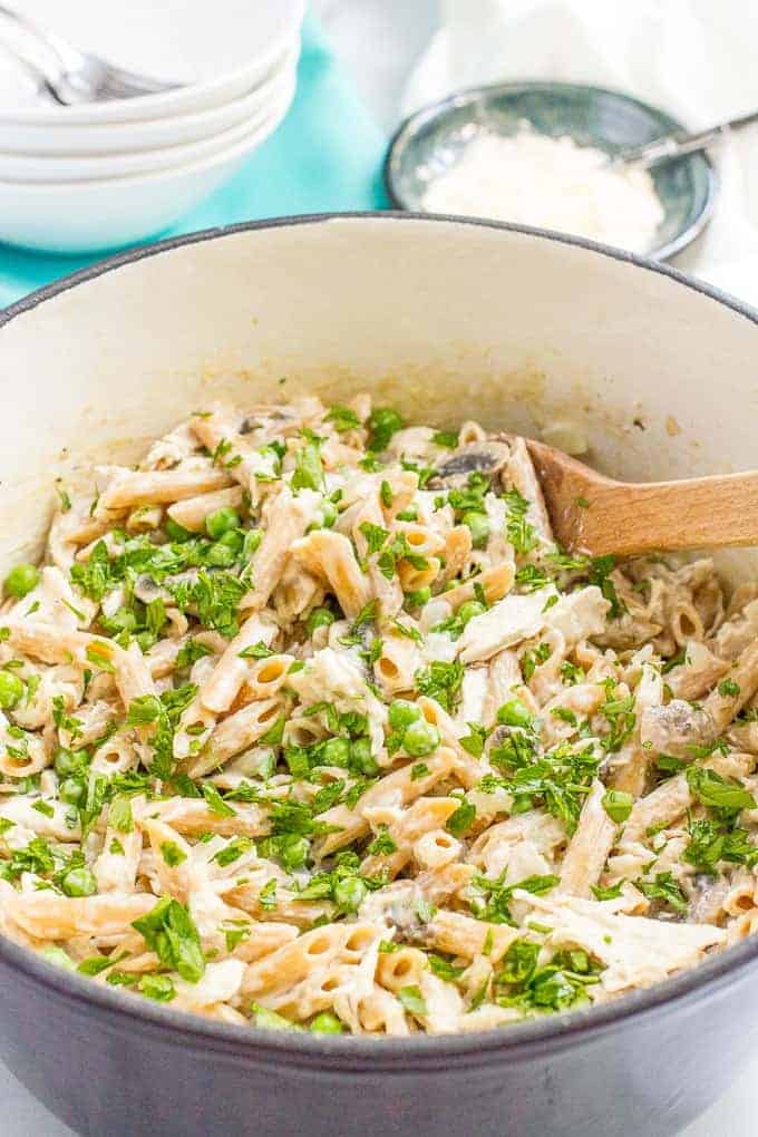 One-pot creamy chicken and mushroom pasta with peas is an easy, complete dinner that’s ready in about 30 minutes!