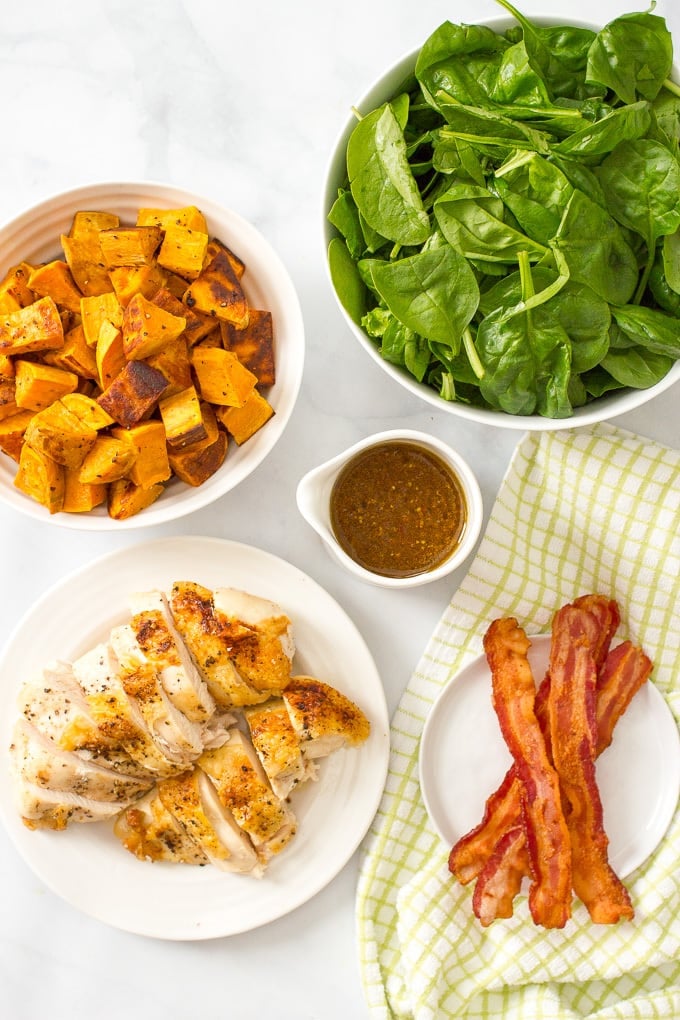 Warm chicken, spinach and sweet potato salad with bacon vinaigrette -- a healthy, hearty main dish salad with big bacon flavor! | www.familyfoodonthetable.com