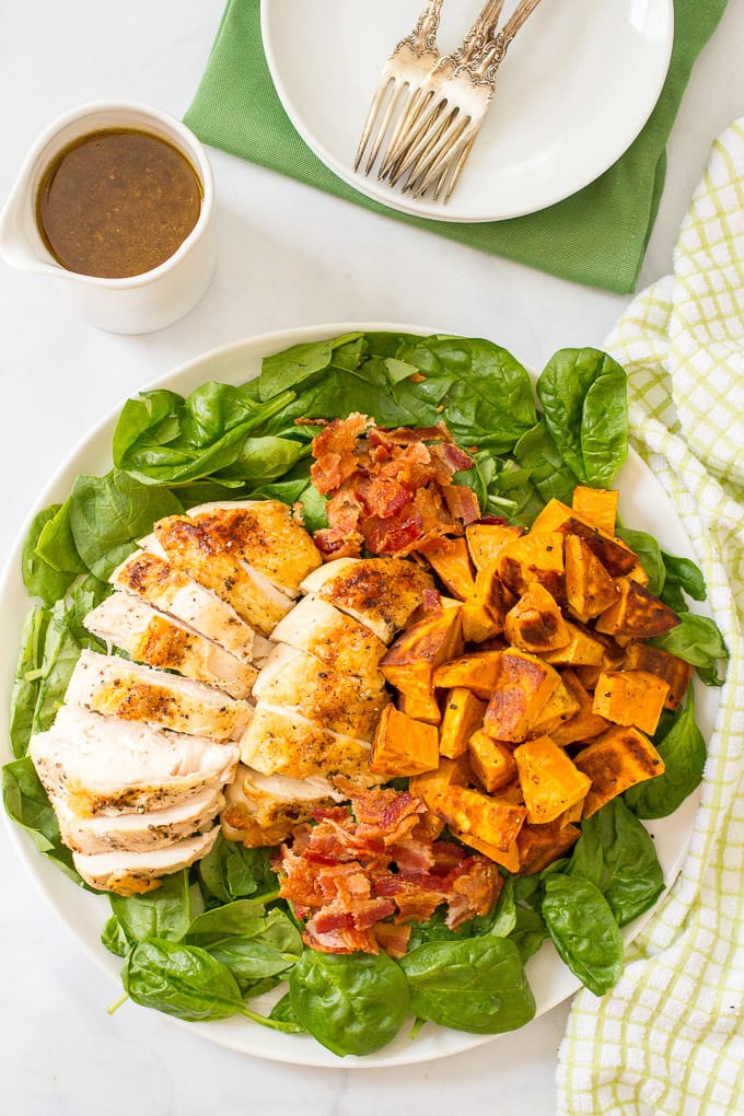 Warm chicken, spinach and sweet potato salad with bacon vinaigrette -- a healthy, hearty main dish salad with big bacon flavor! | www.familyfoodonthetable.com