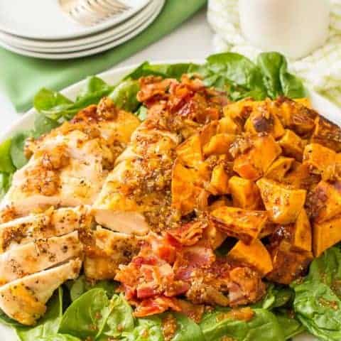 Warm chicken and sweet potato salad with bacon vinaigrette, served over fresh spinach, is a hearty main dish salad with big bacon flavor! | www.familyfoodonthetable.com