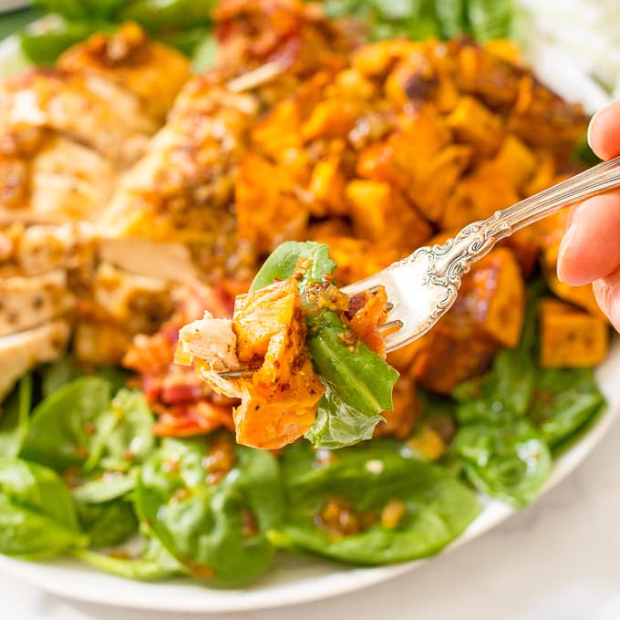 Warm chicken, spinach and sweet potato salad with bacon vinaigrette -- a healthy, hearty main dish salad with big bacon flavor! | www.familyfoodonthetable.com