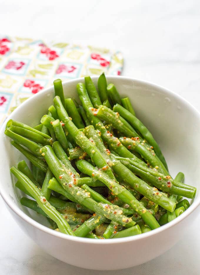 Green beans with mustard butter sauce is a quick and easy side dish with only 5 ingredients! | www.familyfoodonthetable.com