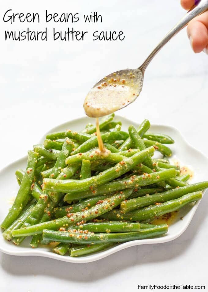 Green beans with mustard butter sauce is a quick and easy side dish with rich, tangy flavor and only 5 ingredients! | www.familyfoodonthetable.com