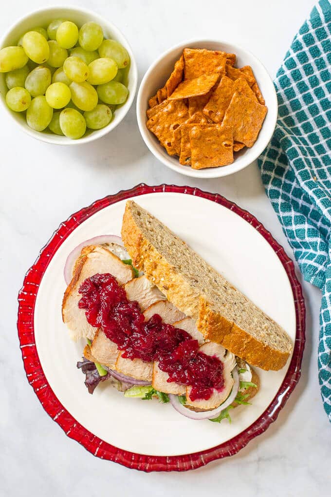 An easy turkey cranberry cream cheese sandwich with greens and red onion that’s the perfect way to use up leftover Thanksgiving turkey!