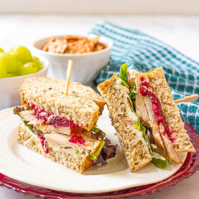 An easy turkey cranberry cream cheese sandwich with greens and red onion that’s the perfect way to use up leftover Thanksgiving turkey!