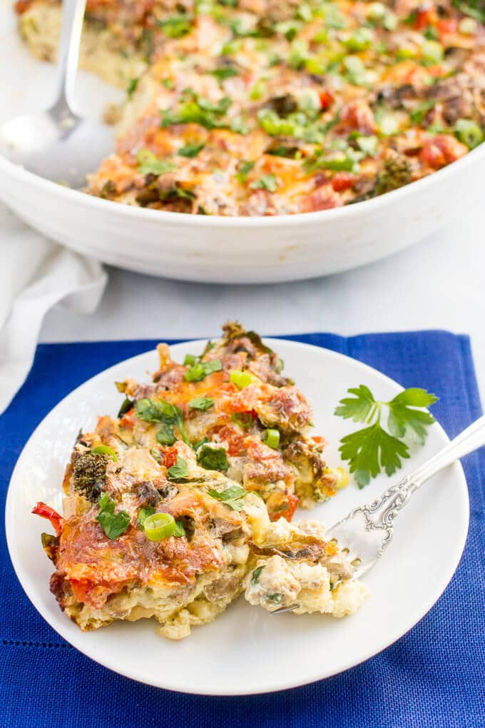 A serving of a veggie loaded breakfast casserole served on a small plate