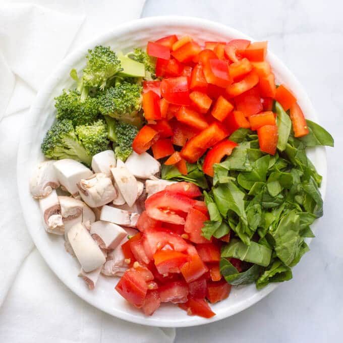 A bowl full of chopped fresh veggies