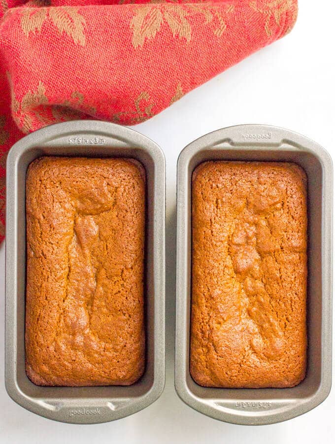 Mini whole wheat gingerbread loaves cooling in bread pans