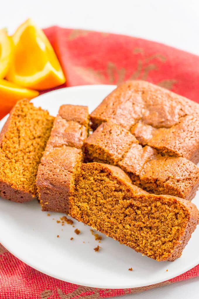 A gingerbread loaf sliced into thick slices and served on a plate