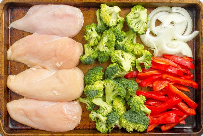 Parmesan sheet pan chicken and broccoli with bell peppers | www.familyfoodonthetable.com