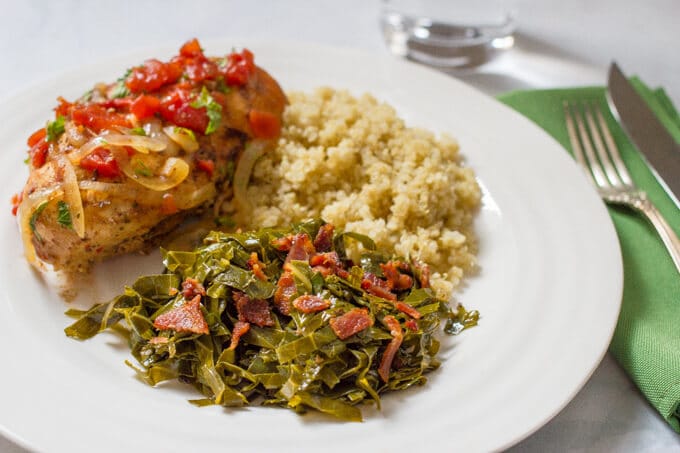 Southern collard greens and bacon served with chicken and rice