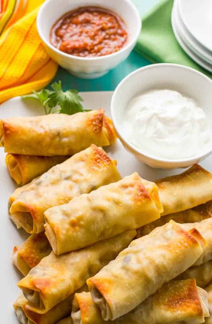 Baked southwestern egg rolls with chicken, black beans and cheese make a perfect game day or party appetizer - these are always a hit! #eggrolls #appetizers #gameday #partyfood