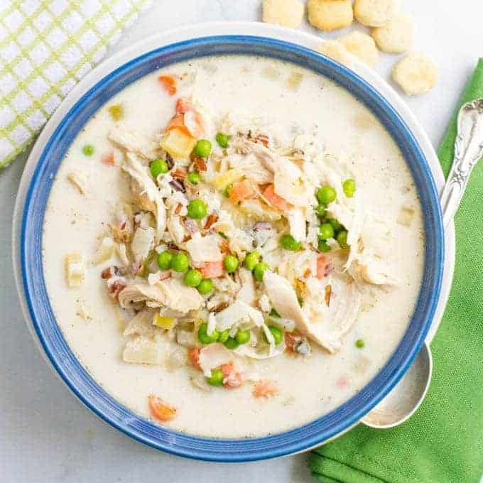 Healthy creamy chicken and wild rice soup is filled with veggies and deliciously creamy while still being very light. And it's ready in just 30 minutes! | www.familyfoodonthetable.com