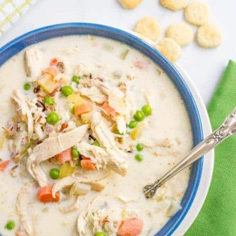 Healthy creamy chicken and wild rice soup is filled with veggies and deliciously creamy while still being very light. And it's ready in just 30 minutes! | www.familyfoodonthetable.com