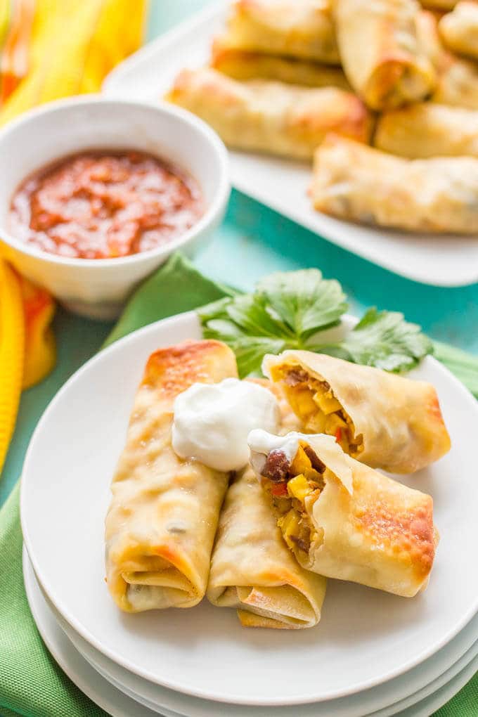 Baked southwestern egg rolls with chicken, black beans and cheese make a perfect game day or party appetizer - these are always a hit! | www.familyfoodonthetable.com