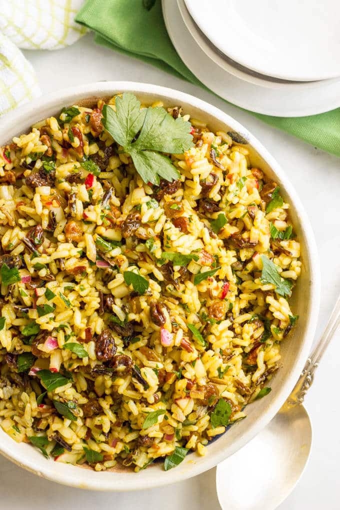 This cold curried wild rice salad with raisins and pecans has amazing flavors and textures and is perfect as a make-ahead dinner side dish or lunch. You’ll be addicted!