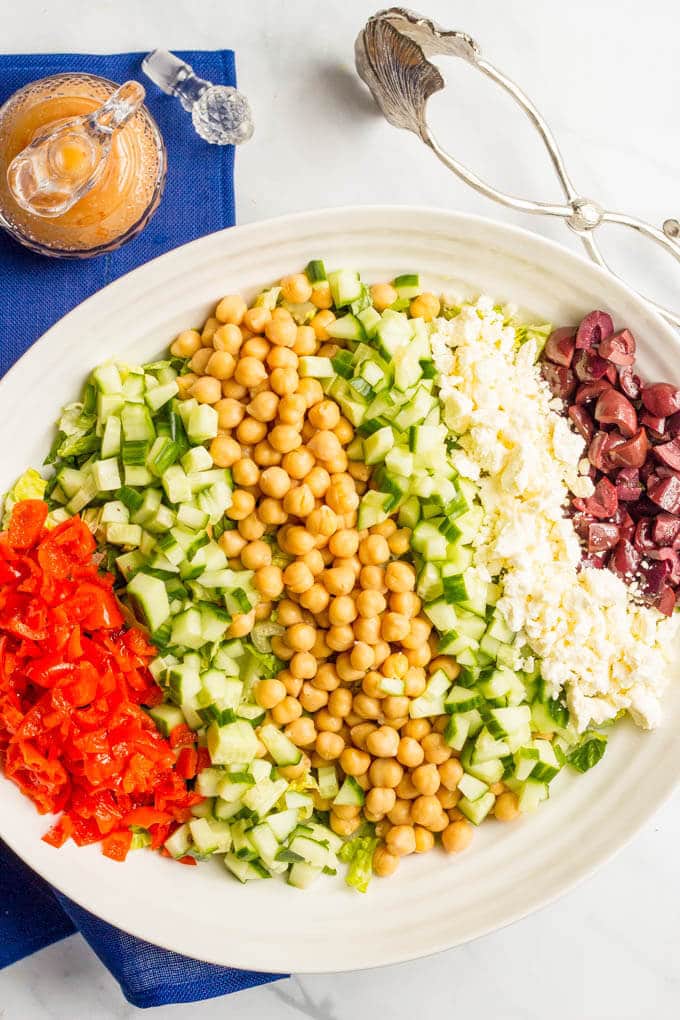Mediterranean chopped salad is a crunchy, flavorful salad with chick peas, olives and feta cheese - perfect for a vegetarian and gluten-free lunch or light dinner!