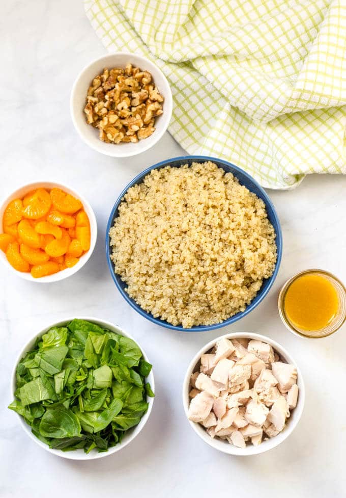 Quinoa chicken spinach salad with mandarin oranges, walnuts and a honey-lime vinaigrette | www.familyfoodonthetable.com