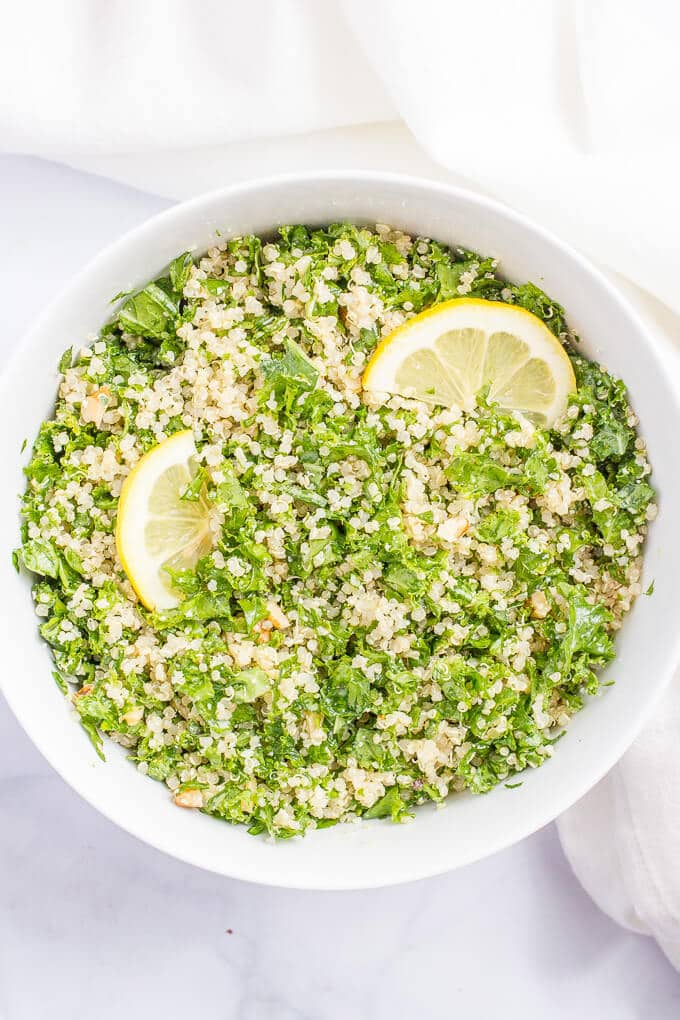 Kale quinoa salad with chopped walnuts, grated Parmesan cheese and a white wine vinaigrette is a light, fresh and healthy side dish! | www.familyfoodonthetable.com