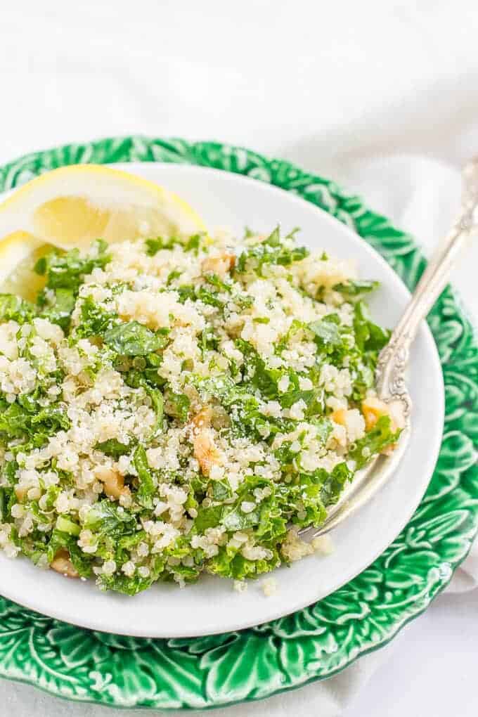 Kale quinoa salad with chopped walnuts, grated Parmesan cheese and a white wine vinaigrette is a light, fresh and healthy side dish! | www.familyfoodonthetable.com