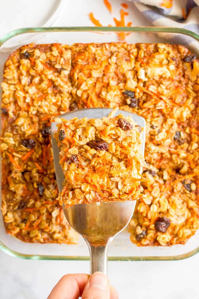 Carrot cake baked oatmeal is naturally sweetened and loaded with walnuts and raisins for a healthy make-ahead breakfast! #carrotcake #oatmeal #bakedoatmeal #breakfastrecipes