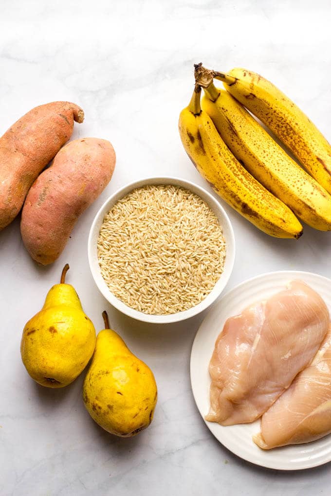 Homemade baby food ingredients laid out on a counter.