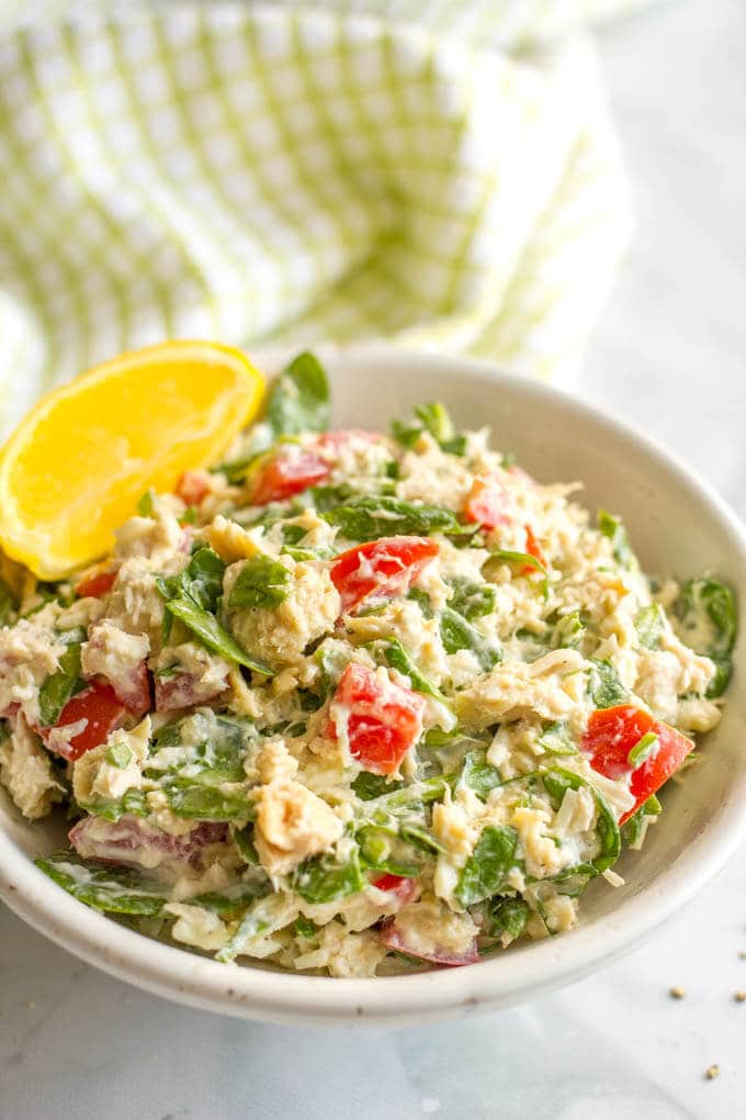 Tuna spinach salad with tomatoes and mozzarella is a light, fresh and healthy lunch ready in just 10 minutes! Serve it as a salad, in a wrap, with crackers or as an open-faced melt! #tunarecipes #tunasalad #healthylunch #lowcarb #glutenfreelunch