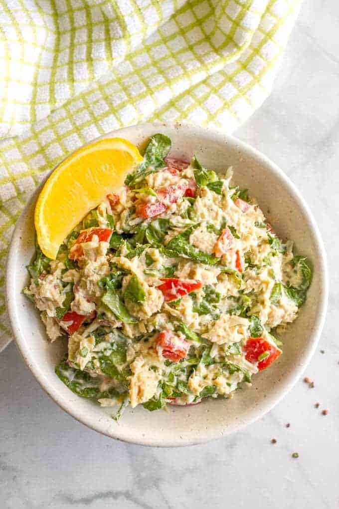 Tuna spinach salad with tomatoes and mozzarella is a light, fresh and healthy lunch ready in just 10 minutes! Serve it as a salad, in a wrap, with crackers or as an open-faced melt! | www.familyfoodonthetable.com