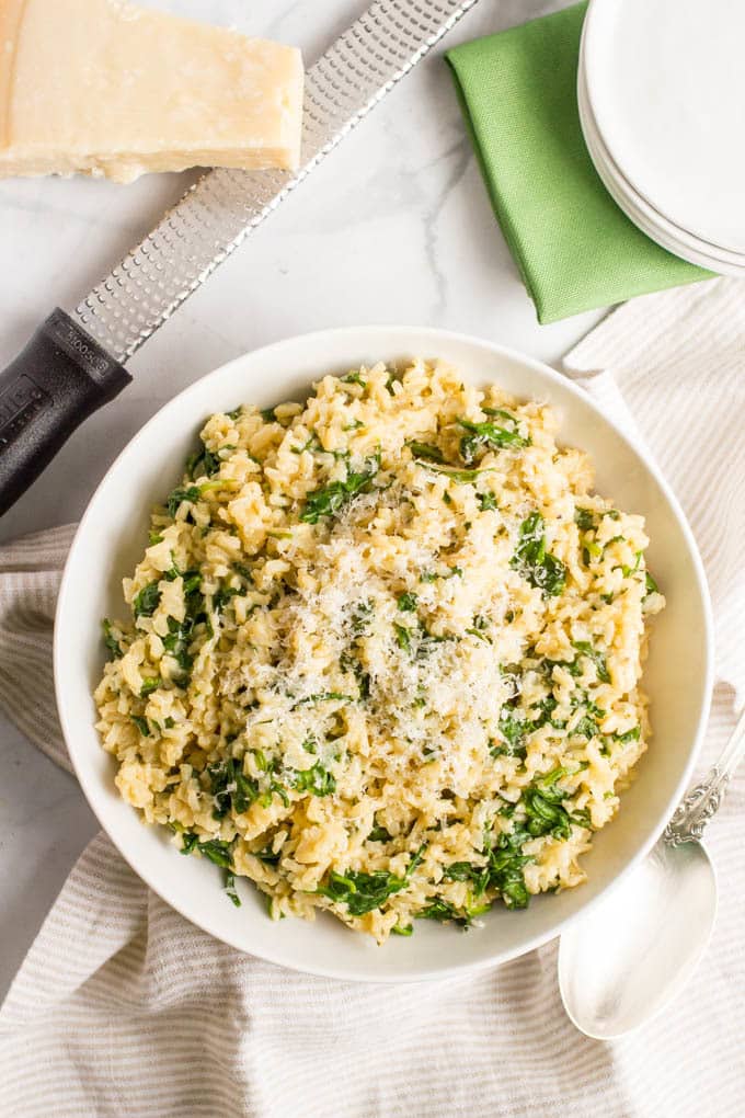 Brown rice with spinach and Parmesan cheese is an easy, healthy, one-pot side dish with just a few simple ingredients! | www.familyfoodonthetable.com