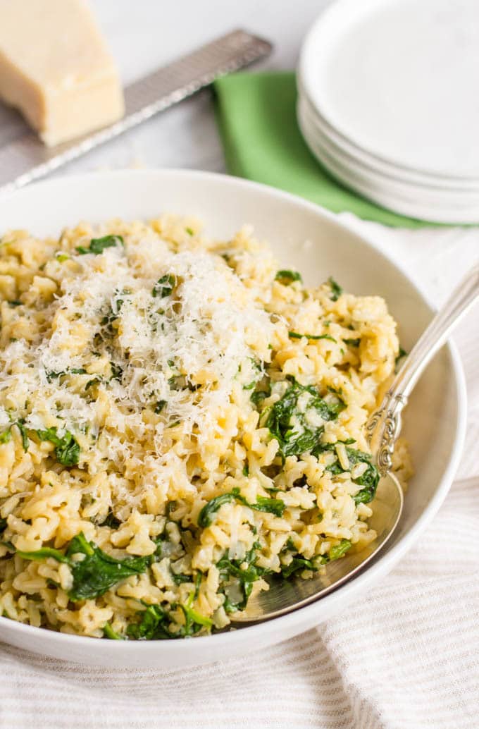 Brown rice with spinach and Parmesan cheese is an easy, healthy, one-pot side dish with just a few simple ingredients! | www.familyfoodonthetable.com