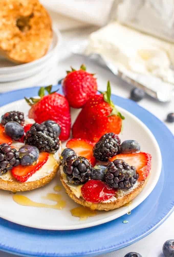 Healthy bagel toppings - cream cheese and berries with honey