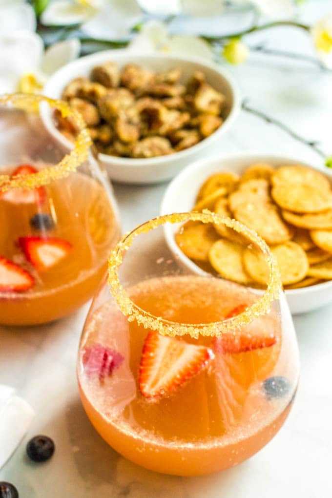 Champagne brunch punch is an easy, fruity, pretty drink recipe that’s perfect for setting out at a brunch party! | www.familyfoodonthetable.com