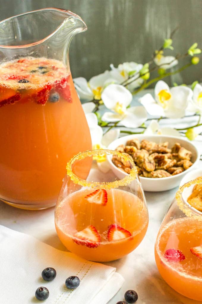 Champagne brunch punch is an easy, fruity, pretty drink recipe that’s perfect for setting out at a brunch party! | www.familyfoodonthetable.com
