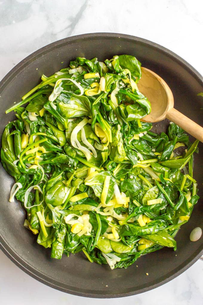 Sautéed spinach and leeks is a quick + easy, healthy side dish with simple ingredients and delicious flavor! | www.familyfoodonthetable.com