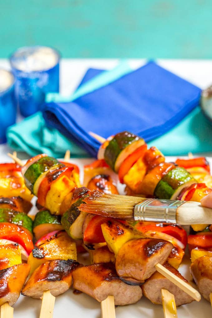 Sausage pineapple kabobs with BBQ sauce are a quick, no-marinade kabob recipe that’s perfect as an easy, flavorful summer appetizer or dinner! | www.famillyfoodonthetable.com