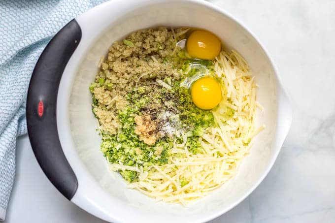 Broccoli cheese quinoa bites ingredients in bowl.