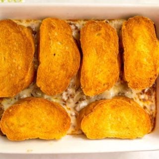 Cheesy sloppy Joe casserole after baking with crusty, golden brown bread