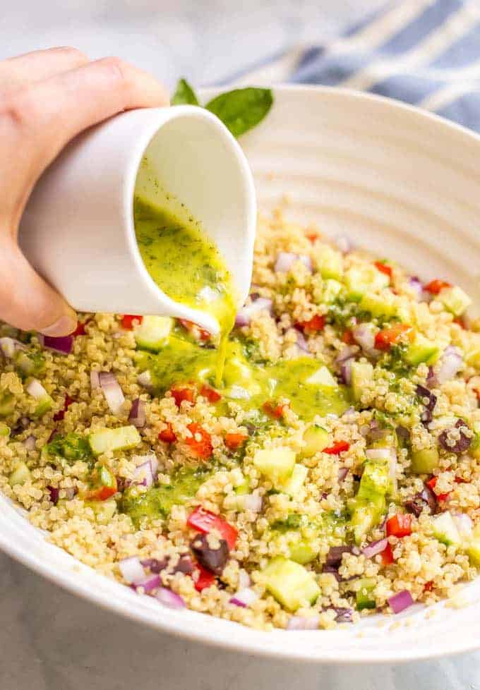 Mediterranean quinoa salad is a flavorful, veggie-loaded salad with great colors, flavors and textures! Great as a vegetarian side dish or add chicken or chickpeas to make it a full meal! #quinoa #saladlove #vegetarianrecipes #glutenfreerecipes #glutenfreefood #healthysalads