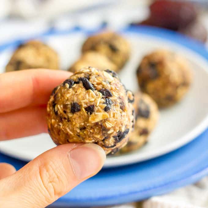 No bake blueberry oatmeal cookie ball held in hand