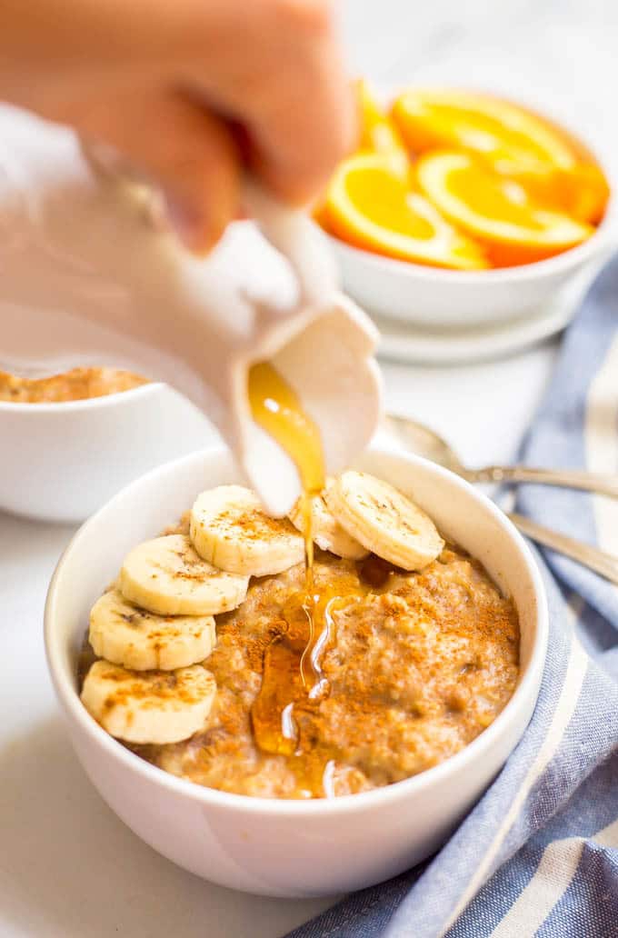 Slow cooker maple cinnamon oatmeal is perfect for busy mornings! Take a few minutes to prep the night before and a creamy, rich, flavorful oatmeal is waiting for you in the morning! | www.familyfoodonthetable.com