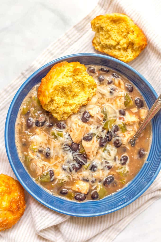 Easy cheesy cornbread muffins with a bowl of chicken black bean soup