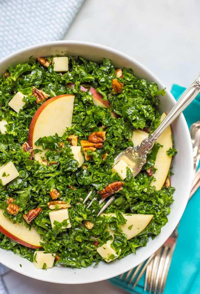 Kale apple salad with cheddar and pecans is an easy, flavorful massaged kale salad that's great as a side or for lunch! | www.familyfoodonthetable.com