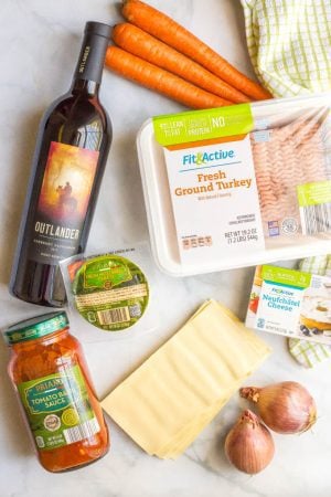 Easy healthy one pot lasagna ingredients laid out on white counter with a green towel