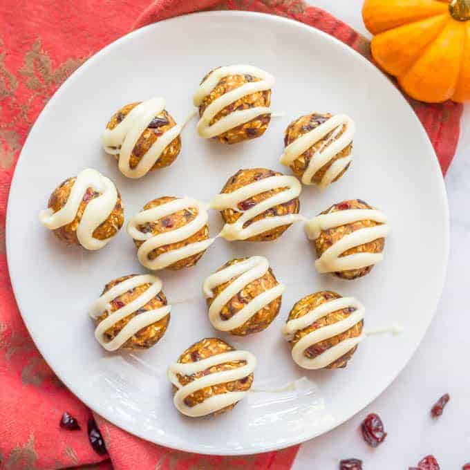 Pumpkin cranberry energy balls with white chocolate drizzle