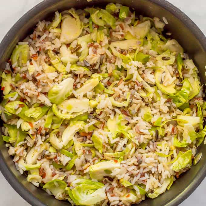 Cooked wild rice and Brussels sprouts in pan