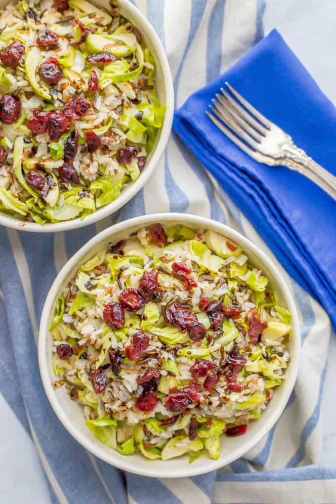 This one-pot wild rice and Brussels sprouts salad is a warm hug in a bowl! It’s an easy side dish with just a few ingredients but has all the cozy fall feelings! | www.familyfoodonthetable.com