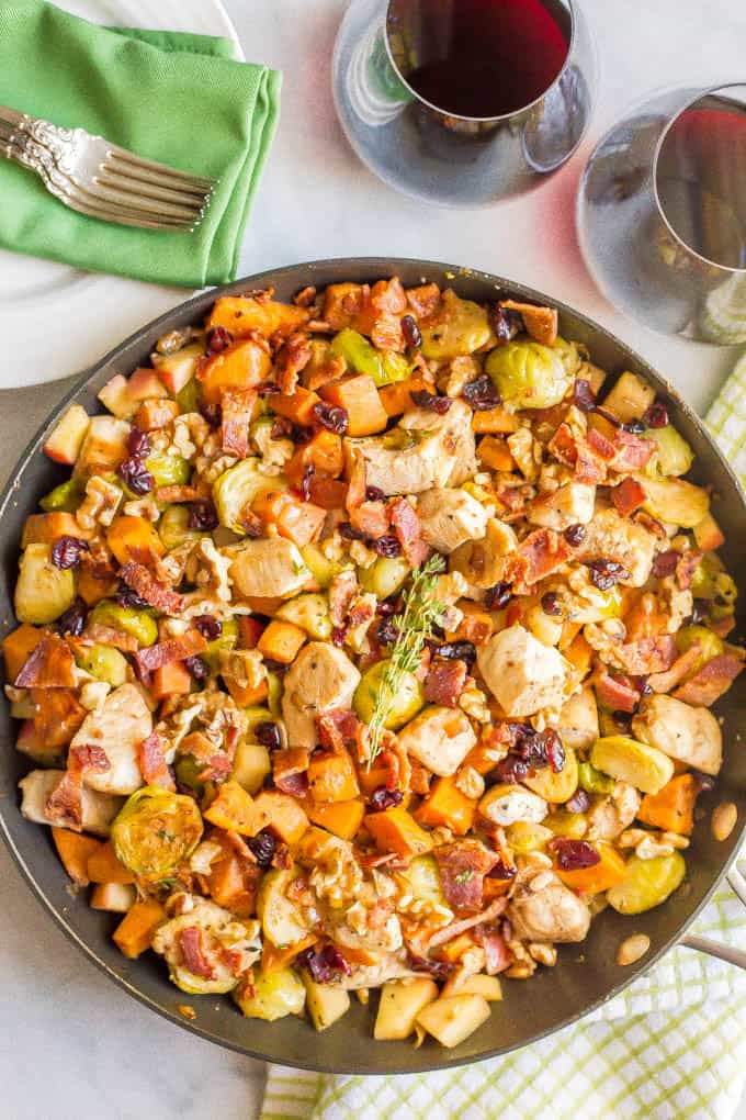 One-pot easy harvest chicken skillet with sweet potatoes and Brussels sprouts is a beautiful and delicious recipe that’s perfect for a fall dinner! #onepot #chicken #easydinner | www.familyfoodonthetable